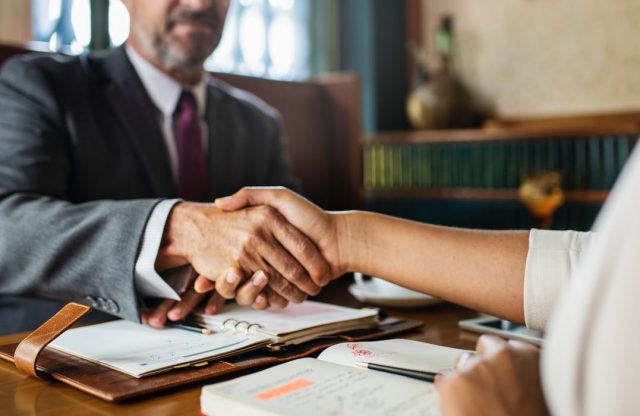 lawyer-client handshaking